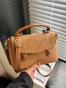 Brown faux suede crossbody bag with gold hardware and top handle for women