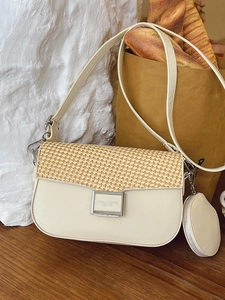 Minimalist beige crossbody bag with straw weave flap and matching round coin purse charm