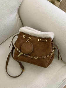 Brown frosted bucket bag with white faux fur trim and embossed patterns for winter