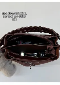 Detailed top view of retro bucket bag interior with compartments and large storage capacity