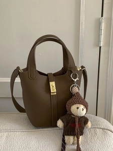 Chic brown litchi pattern leather bucket bag with top handles and cute bear charm
