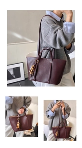 Detail of dark burgundy tote bag featuring matte PU leather and decorative wooden beads