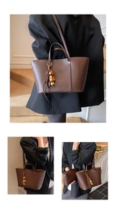 Detail of dark brown tote bag with wood bead tassel and matching pouch in a set