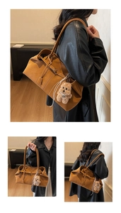 Detail view of caramel tote bag with soft leather texture and plush bear pendant