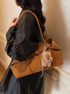 Minimalist vintage brown faux leather tote bag with cute bear charm for daily commute