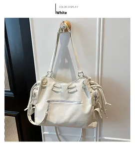 Detail view of white vintage hobo bag with side drawstrings and front zipper pocket