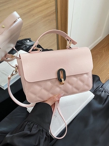 Elegant pink quilted PU leather handbag with a top handle and gold-tone oval buckle closure