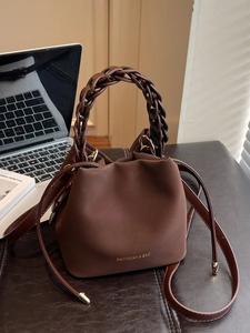 Minimalist dark brown PU leather bucket bag with braided handle for women