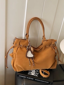 Retro mustard yellow faux leather tote bag with drawstring side and leopard heart mirror