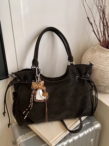 Retro large brown tote bag in faux suede with leopard heart charm on a metal suitcase