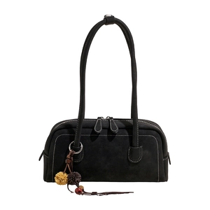 Retro black matte underarm bag with contrast stitching and ethnic charm accessory