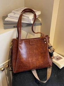 Brown vintage faux leather tote bag with ethnic embroidery strap and cute bunny pendant