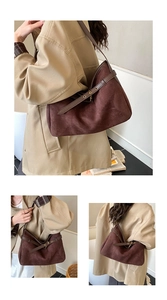 Detailed close-up of dark brown faux suede tote bag with stylish metallic buckle strap