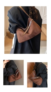 Detail showing the matte suede texture and polished leather trim of the brown tote bag