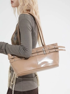 Glossy khaki patent leather tote bag with pleated belt buckles and thin shoulder straps