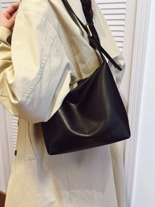 Minimalist black soft leather hobo tote bag for women with spacious commuter design