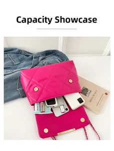 Capacity display of fuchsia quilted chain bag showing phone, perfume and lipstick inside