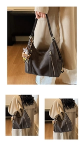 Detail of dark brown matte tote bag with dual straps and cute teddy bear pendant