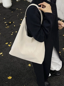 Retro cream white leather oversized tote bag on shoulder with casual hobo style