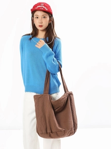 Minimalist brown canvas tote bag for women featuring a spacious retro slouchy design