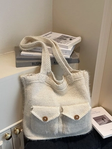 Creamy white oversized knit tote bag with plush texture and decorative wooden buttons