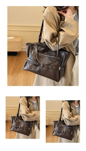Detail of dark brown vintage leather tote bag with buckle accents worn with a trench coat