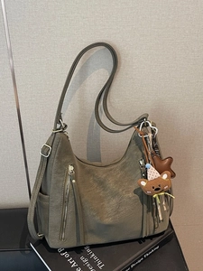 Vintage olive green large tote bag with decorative zippers and adjustable straps
