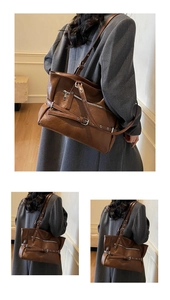 Detail of vintage brown tote bag with silver zippers and decorative eyelet straps