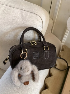 Vintage dark brown faux suede bowling bag with gold hardware and plush rabbit charm