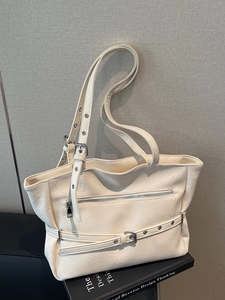 Chic cream oversized PU leather tote bag with stylish buckle strap and front zip pocket