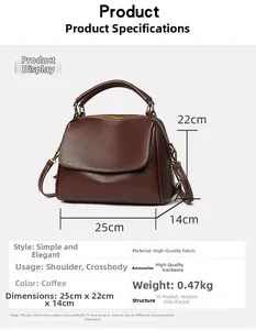 Detail view of coffee leather handbag with dimensions 25x22x14cm and gold hardware