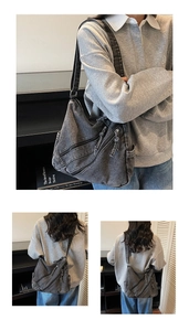 Detail of washed black denim crossbody bag with multiple zippers and wide strap