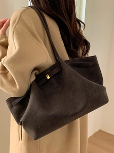 Dark brown suede tote bag for women featuring gold buckle details and long shoulder strap