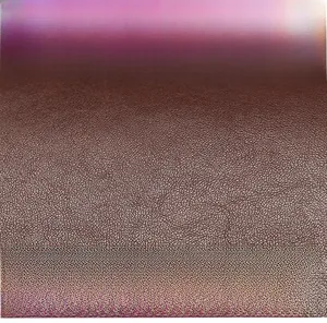 Close-up of soft brown lychee grain leather texture with premium matte finish