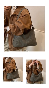 Detailed view of large vintage grey tote bag with soft suede texture and vertical stitching
