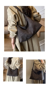 Detail of a large coffee suede tote bag showing soft matte texture and slouchy design
