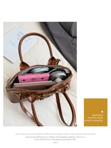 Internal view showing capacity of the brown glossy leather shell bag with organized compartments
