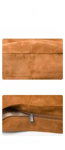 Vue détaillée du tissu en toile lavée marron avec coutures renforcées et fermeture éclair en métal