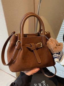 Retro dark brown faux suede bucket bag with adjustable strap and teddy bear charm