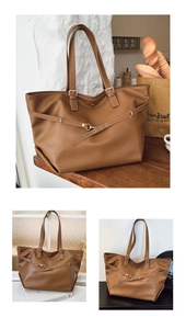 Dettaglio di una grande borsa tote marrone vintage con finiture dorate e design francese