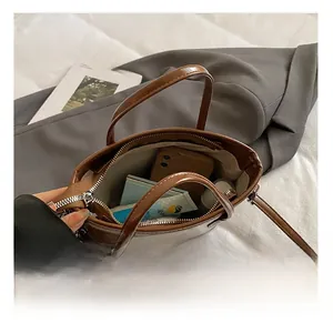 Top view of brown leather bucket bag showing large interior capacity for daily items