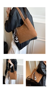 Detail of brown suede tote bag featuring a cute dog charm and stylish golden logo