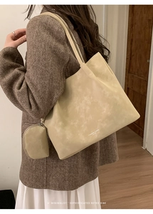 Detail of cream tote bag set with matching coin purse and retro fashion lettering