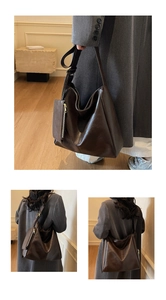 Detail of dark brown tote bag with matching detachable pouch and thick shoulder strap