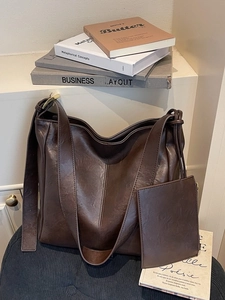 Retro dark brown leather shoulder bag with wide strap and matching mini coin pouch charm