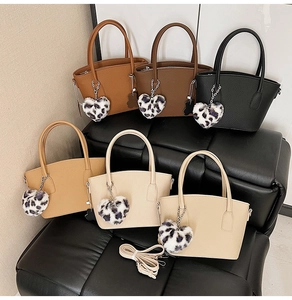 Collection of retro bucket bags in six colors with leopard print heart charms