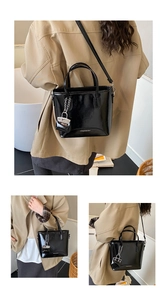 Glossy black patent bucket bag with mini pouch and adjustable strap detail
