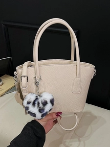 Cream retro bucket bag with litchi texture and heart leopard plush pendant