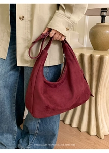 Close-up of burgundy faux suede hobo bag showing premium frosted texture and metal zipper