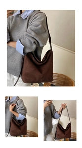 Detail of a large brown suede hobo bag showing minimalist style and matte texture
